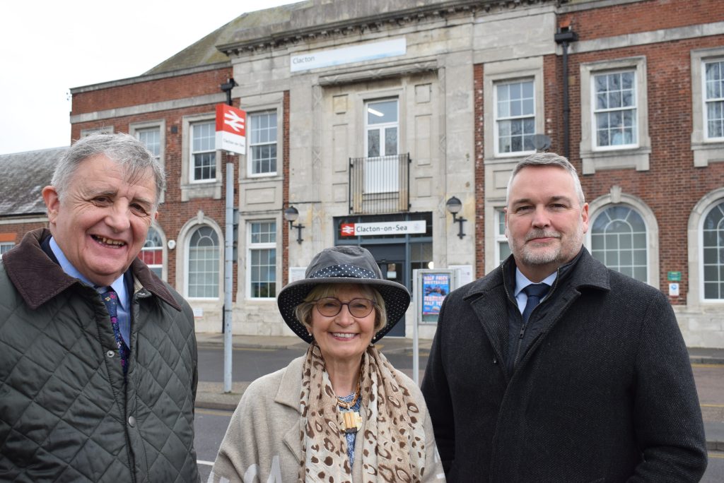 Three people stood outside Clacton Railway Staton